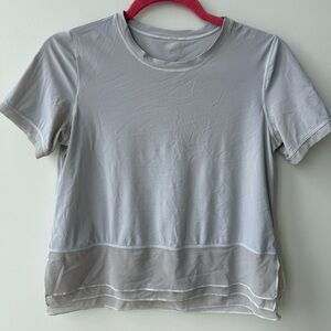 Lululemon grey short sleeve with layered mesh bottom detail